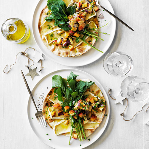 Baked flatbreads with brie, peaches and rocket