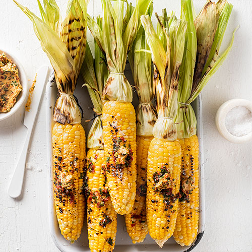 Barbecued corn with flavoured butters